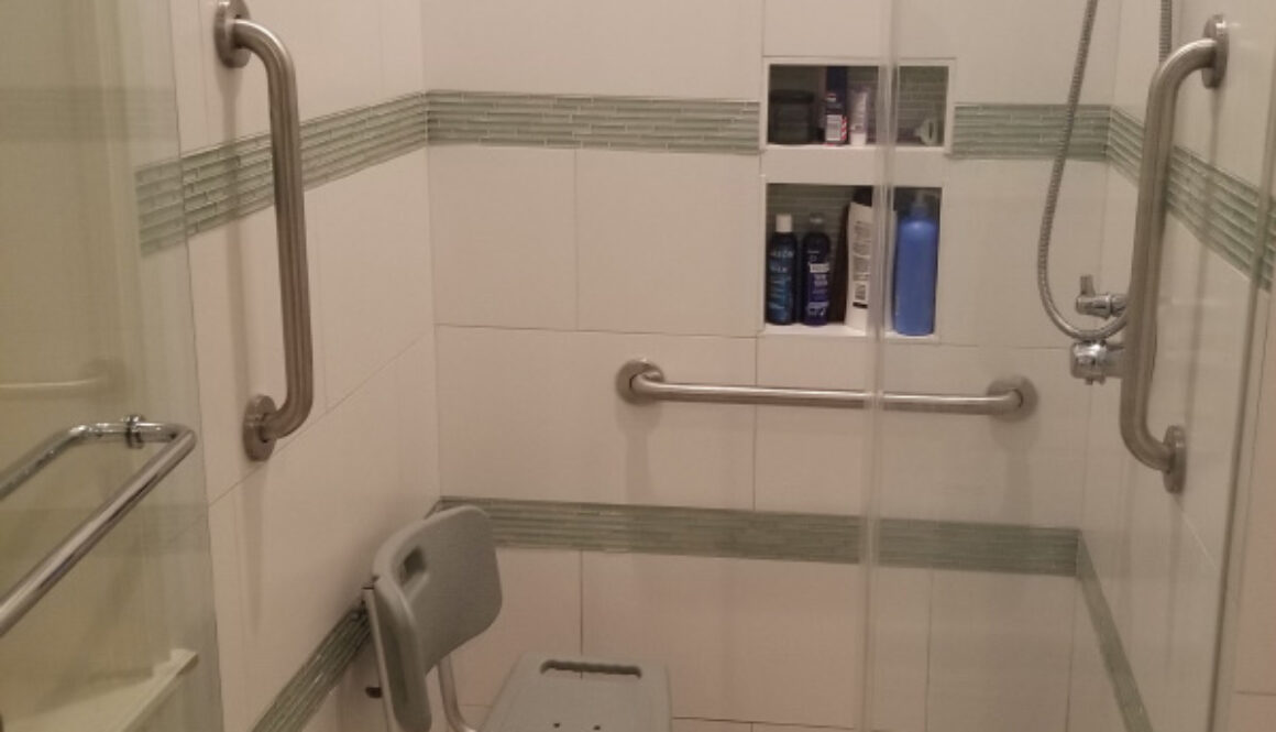 Grab Bars Installed In Walk In Shower With Shower Chair