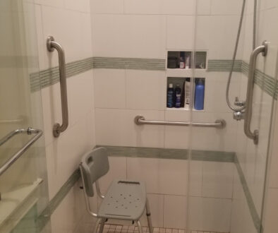Grab Bars Installed In Walk In Shower With Shower Chair