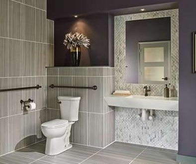 Modern bathroom with gray tiles and stylish decor.