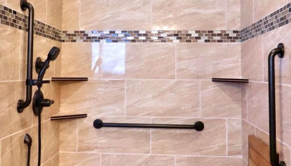 Accessible shower with grab bars and bench.