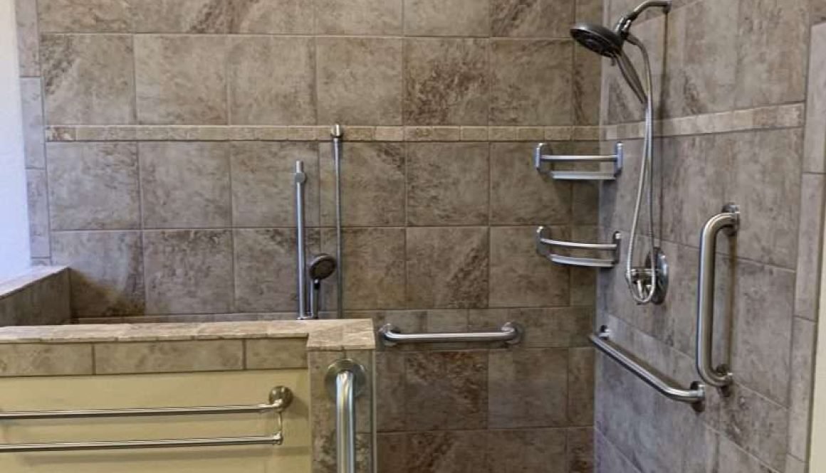 Accessible shower with grab bars and tiled walls