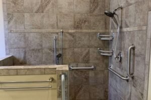 Accessible shower with grab bars and tiled walls