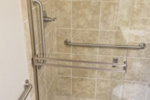 Stainless Steel Grab Bars Installed In Tiled Shower