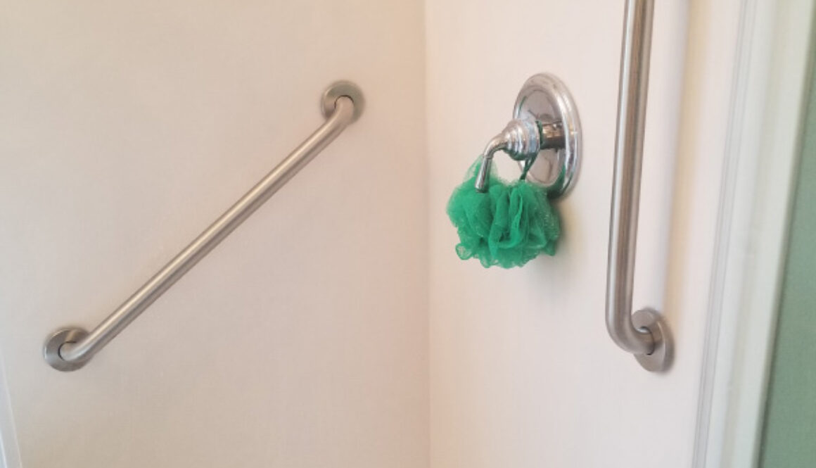 Two Stainless Steel Grab Bars Installed In Pre Fabricated Shower