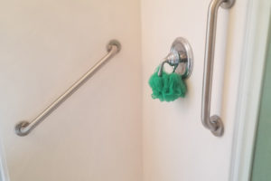 Two Stainless Steel Grab Bars Installed In Pre Fabricated Shower