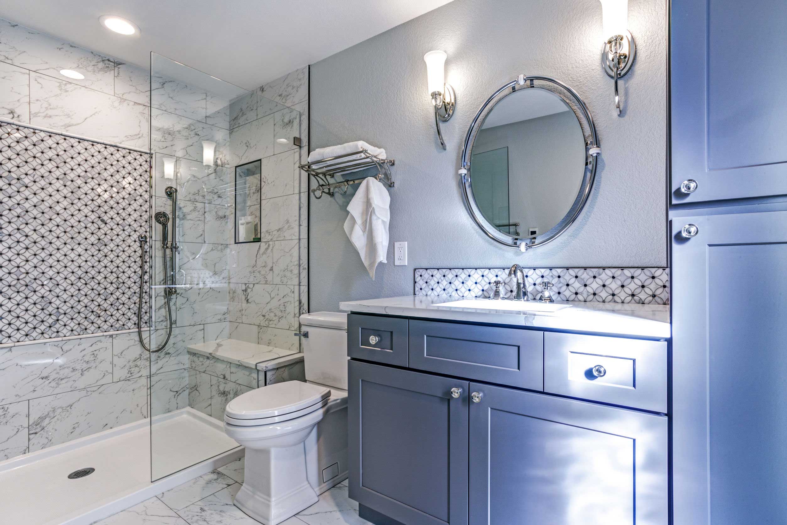 Modern bathroom with marble tiles and elegant fixtures.